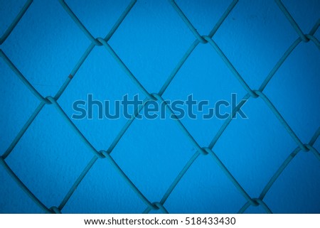 steel mesh knit and blue cement wall background, pattern of steel mesh knit and blue cement wall, vintage style picture