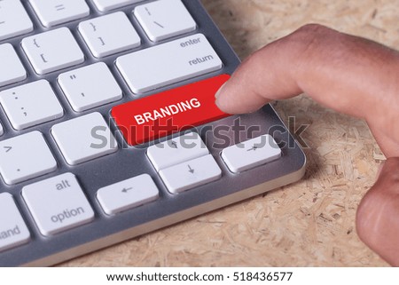 Man pressed keyboard button with BRANDING word