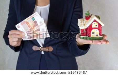 House and money in hand