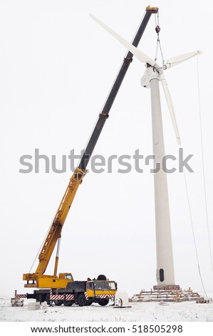 Installation of a wind turbine in winter Royalty-Free Stock Photo #518505298