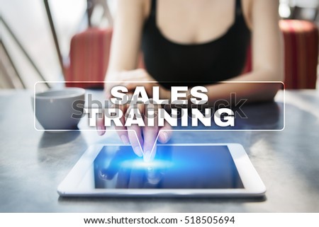 Woman using tablet pc and selecting sales training.