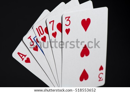 Flush in poker game on a black background