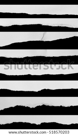 Collection of white paper tears, isolated on black background.