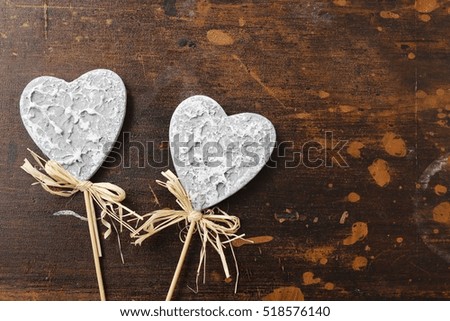 Grey hearts on wooden background, copy space. 