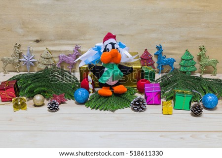 Christmas background with decorations and gift boxes on wooden board
