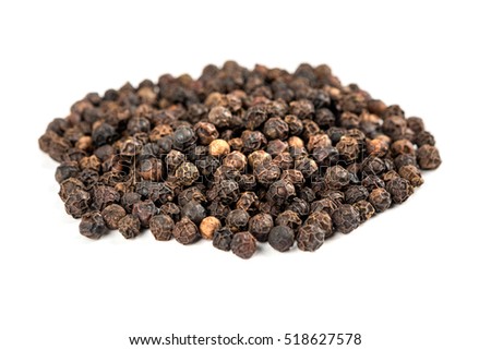Pile of black peppercorns isolated on white background