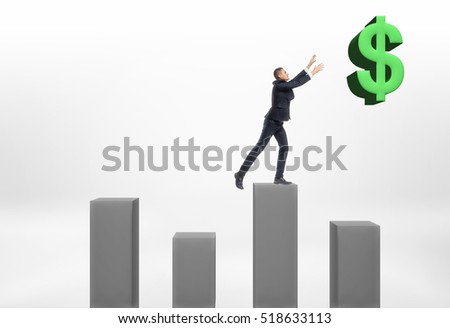 Businessman standing on grey column with his hands up to the big dollar sign on the white background. Business and finance. Statisics and data. Earning money.