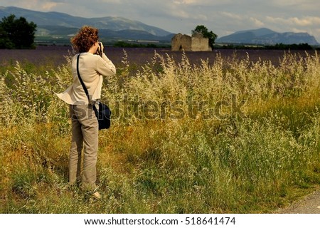 lady photographing a lavender field, Provence, France
