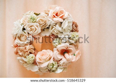 wreath of fabric flowers in pastel color. wedding decor 