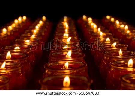 Candles in a thailand temple on black background