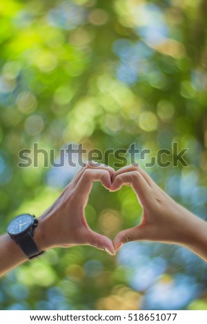 hands in shape of love heart - vintage style picture and vintage color
