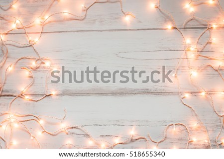 Christmas lights wooden background