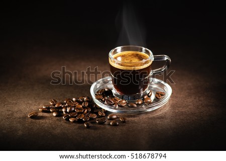 Cup of espresso coffee on dark background. Royalty-Free Stock Photo #518678794