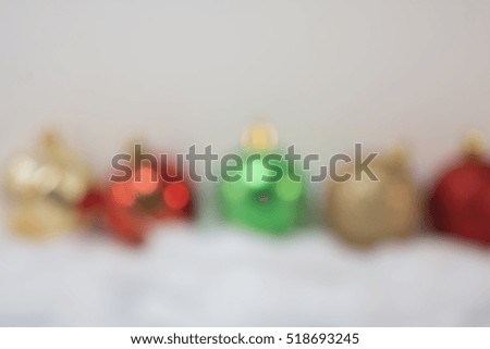 a blurred picture of Christmas balls on white background