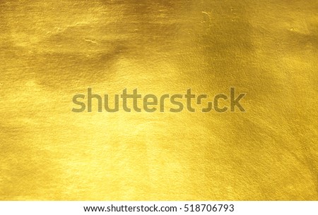 Shiny yellow leaf gold foil texture background Royalty-Free Stock Photo #518706793