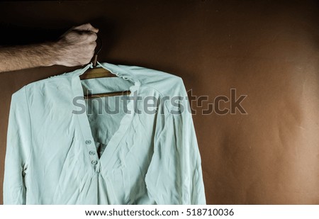 iron and white wrinkled shirt