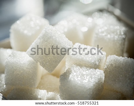 Close up shot of white refinery sugar. Royalty-Free Stock Photo #518755321