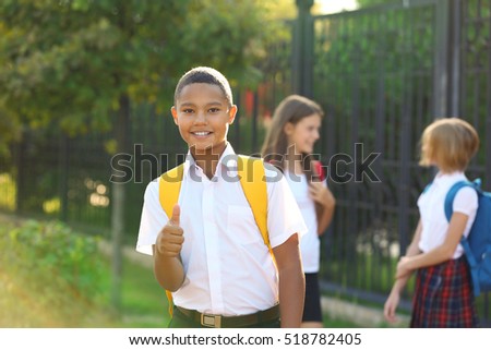 Teenager boy and his friends going to school