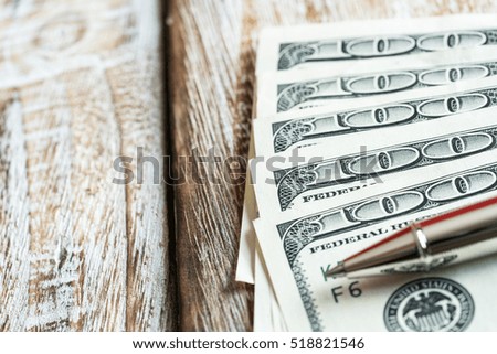 Money dollars on wooden background, business concept.