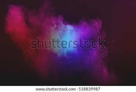 abstract powder splatted background. Powder explosion on black background. Colored cloud. Colorful dust explode.