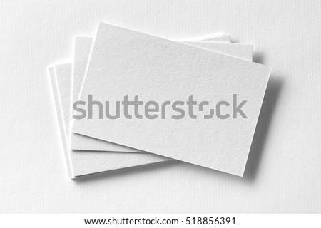Mockup of business cards fan stack at white textured paper background. Royalty-Free Stock Photo #518856391