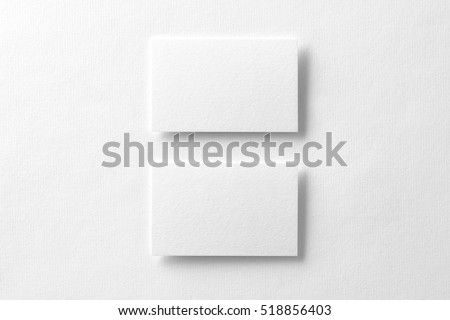Mockup of two horizontal business cards at white textured background. Royalty-Free Stock Photo #518856403