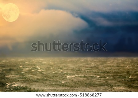 Sea and clouds before storm. Arctic ocean from height of bird flight - free of ice thereby storms, evening moonrise (plenilune). Global warming cause of hurricanes. 