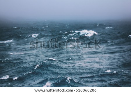 Vicious circle. Melting, breaking of Ice caps at North pole leads to overheating of water in summer, to stormy weather and destruction of ice: turbulent waves of Arctic ocean (offing, 82-83 degrees N) Royalty-Free Stock Photo #518868286