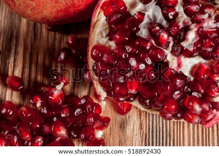 pomegranate on old wooden table