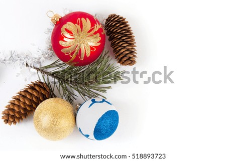 Christmas and New Year composition of conifer twigs, cones, balls and decorations on white background