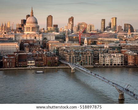 St. Paul's Cathedral and the City of London skyline. High angle view over the River Thames, London, with the skyline dominated by the dome of St. Paul's Cathedral at dusk.