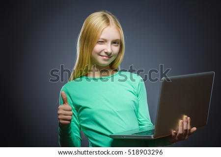 Closeup portrait successful happy girl show thumb up and using laptop isolated grey background