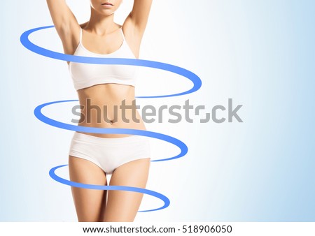 Close-up of thin and beautiful female body. Weight loss, sports, exercising, water balance, healthy nutrition concept. Blue arrows.