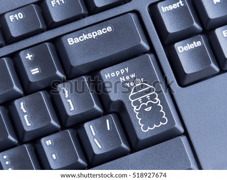keyboard with printed image of Santa Claus inscription happy new year