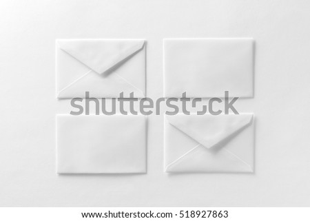 Mockup of four envelopes at white textured paper background.