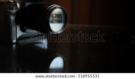 Camera lens isolated on the black background. Copy space