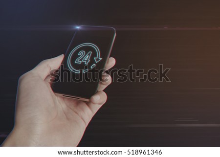 Close up of man hand holding smartphone with 24 Hours Icon on Light Motion Background and Lens Flare - Digital 3d Effect Style Color