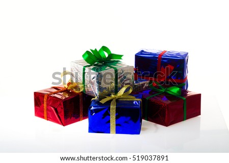 Gifts in a colorful packaging on a white background, studio lighting