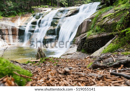 Waterfall in the mountains in Czech Republic.This remarkable and beautiful waterfall is located in the Giant Mountain National Park.