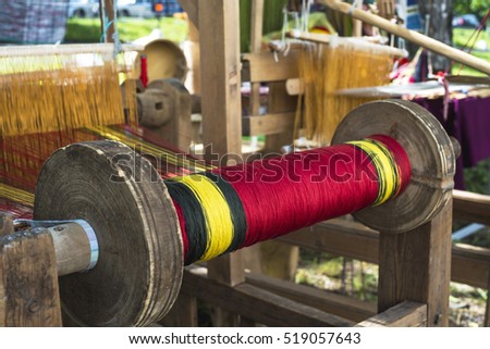 spool of thread for the old loom with shallow depth of field