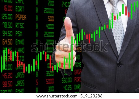 Businessman hand thumbs Candlestick Chart, investment concept