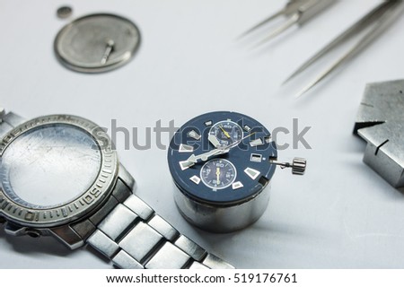 Watch repair on the table.