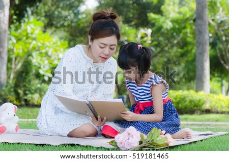 teacher teach child in park