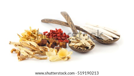 Group of chinese medicine herbs, oriental healthy ingredients on wooden spoon on white background. Royalty-Free Stock Photo #519190213