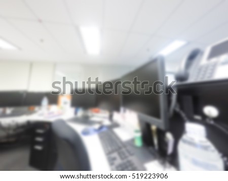 Businessmen blur in the workplace. Abstract blur background table work in office with computer. Shallow depth of focus about stationary in office.