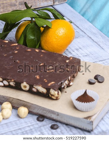 yummy chocolate sweets with hazel nut and tangerines