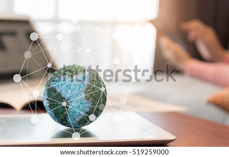 Mock up the global with digital social media network on tablet computer with women using mobile at home. Concept of Global Connect, Globalization, Networking. Royalty-Free Stock Photo #519259000
