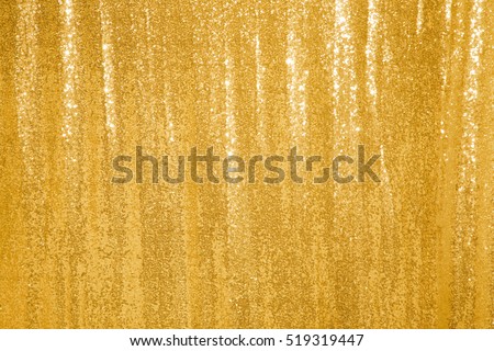 Beautiful golden glitter background. Texture. Holiday background with golden sequins, copyspace, Curtain Show. Sparkling sequined textile
