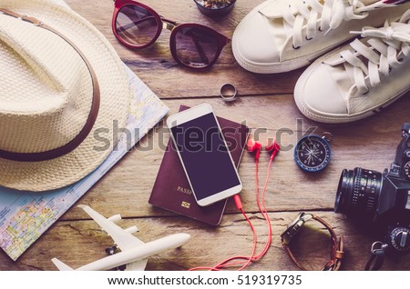 Travel accessories costumes. Passports, luggage, The cost of travel maps prepared for the trip Royalty-Free Stock Photo #519319735