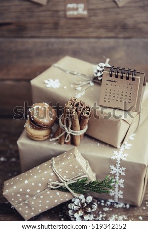 Stack of Christmas gift boxes with  on  wooden background